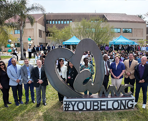 College leaders stand by the #YouBelong statue