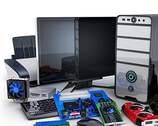 A pile of computer components, monitor, printer