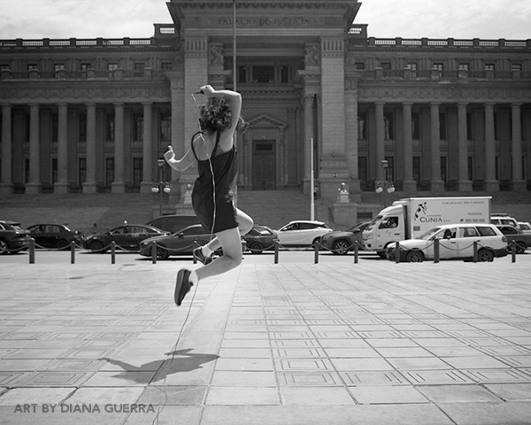 No Hay Justica by Diana Guerra, a black and white photo of the artist jumping in front of a government building