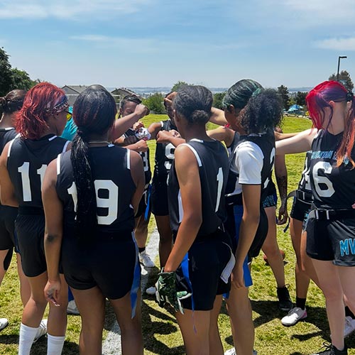A photo of the team during a huddle