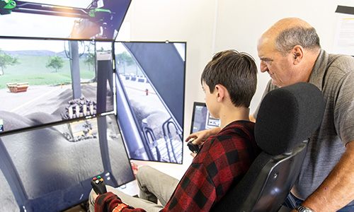Career seekers sit in simulation booths