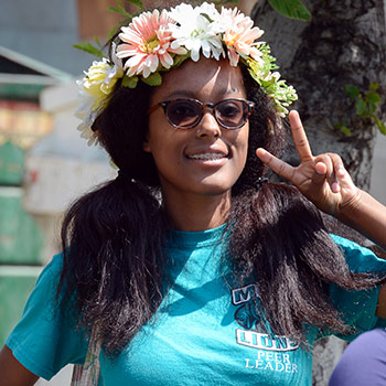 An MVC student flashes the camera a peace sign