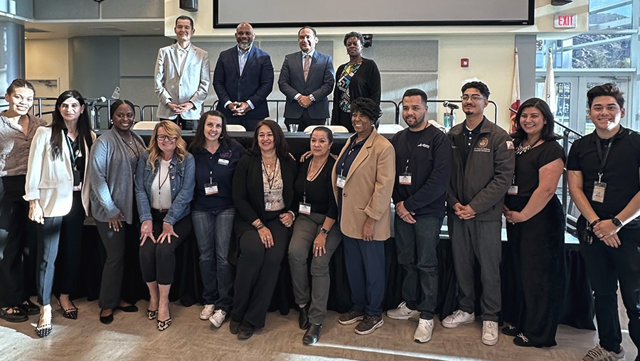 Leadership academy attendees pose with panelists