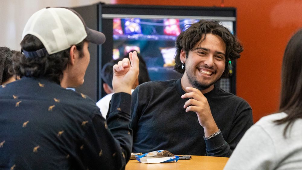 Students gather and socialize in the Student Academic Services building