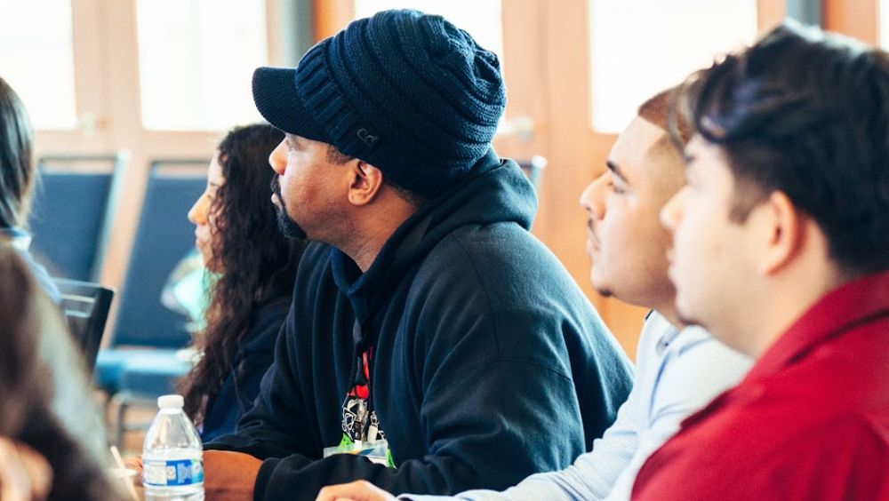 Charles Long in class, looking away from the camera at the instructor