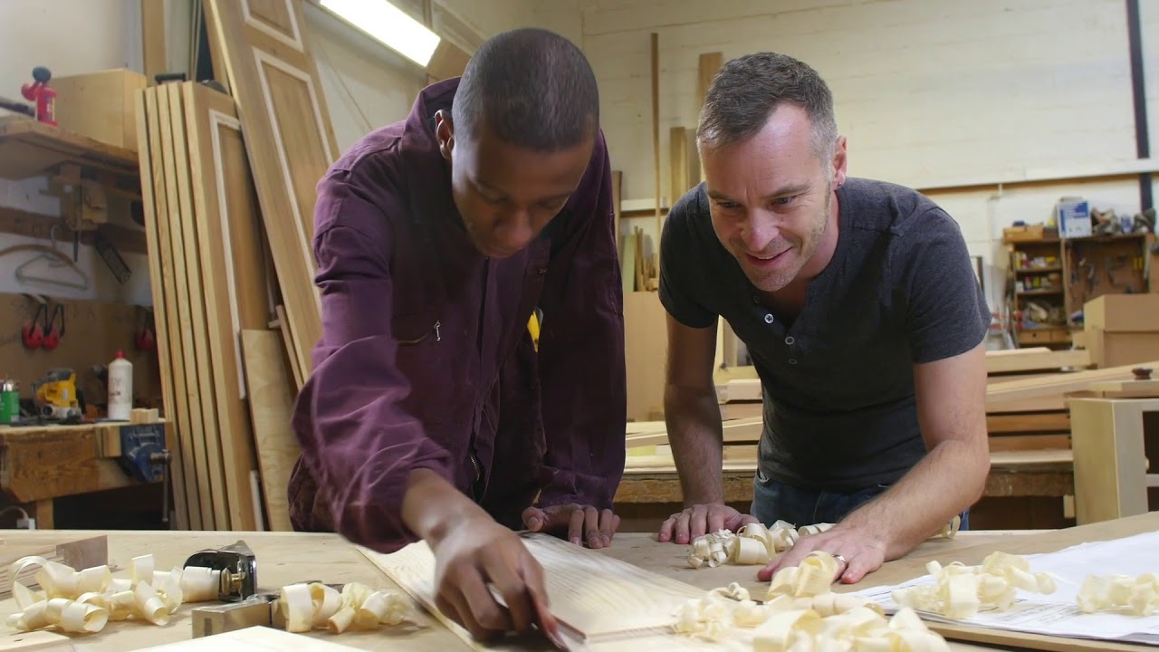 An apprentice and business owner work on a carpentry project. Part of a video on apprenticeship.